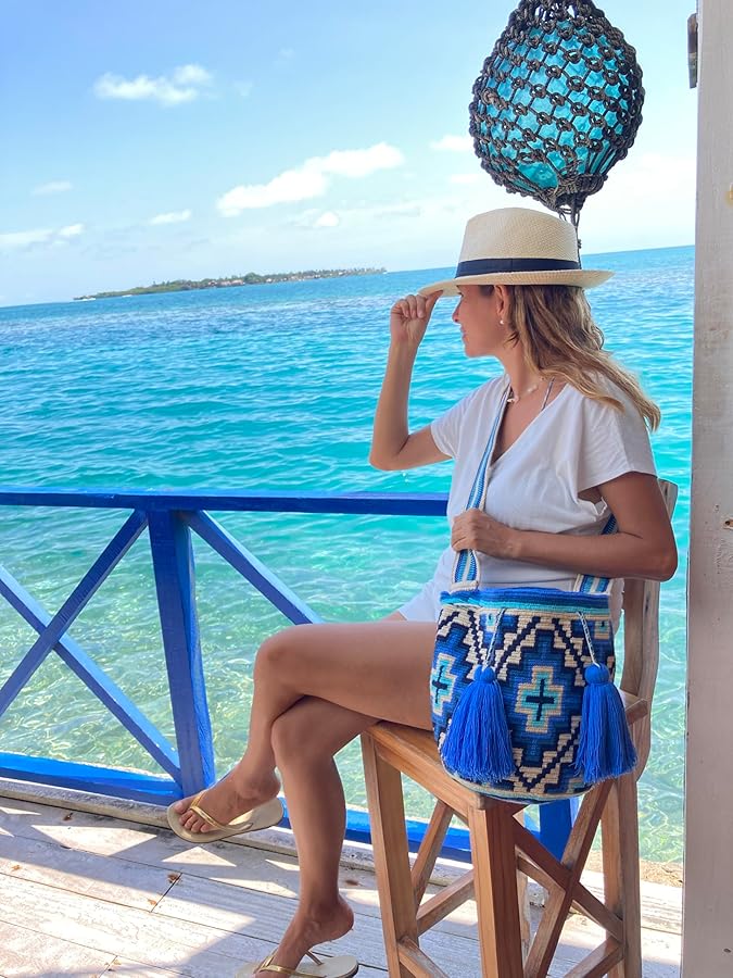 Colorful Wayuu bags displayed in a natural setting