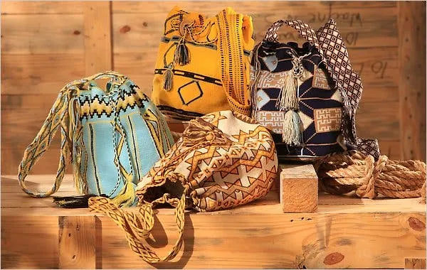 Colorful Wayuu bags displayed in a natural setting